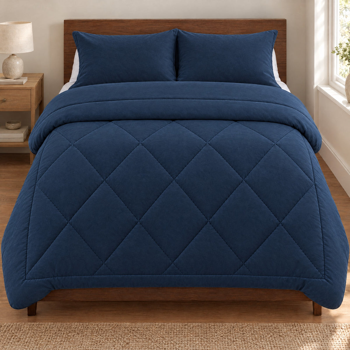 Duvenna coverless duvet in Navy on a walnut bed with matching pillowcases Image