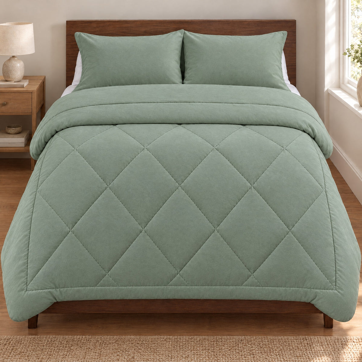 Duvenna Coverless Duvet in Sage Green on a double bed with matching pillowcases Image