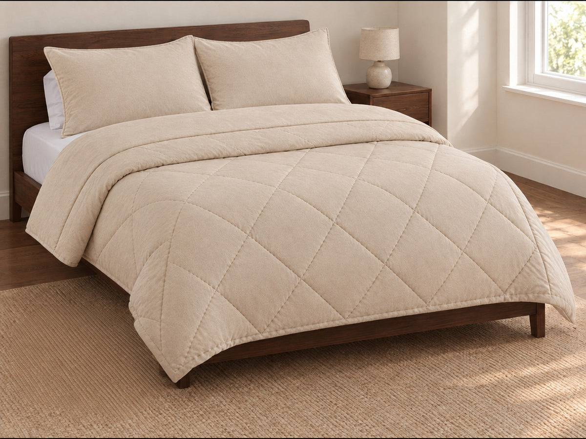 Duvenna coverless duvet in Cream on a bed with its matching pillowcases, included free with every duvet Image